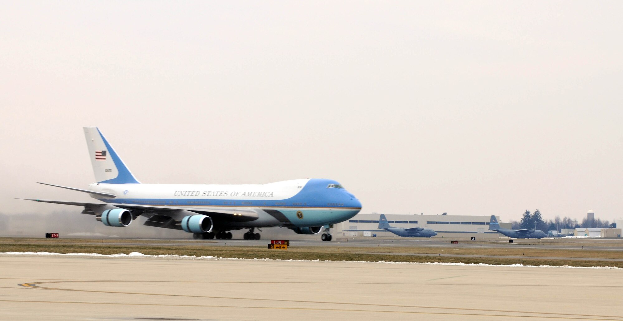Air Force One touches down at New Castle County Airport, New Castle, Delaware on Jan. 12, 2010, passing several parked C-130 transport aircraft of the 166th Airlift Wing, Delaware Air National Guard. Air Force One brought President Barack Obama and first lady Michelle Obama to the state to attend funeral services for the mother of Vice President Joseph R. Biden, Jr., a Delaware resident. (U.S. Air Force Photo by Senior Master Sgt. Gerald F. Dougherty)
