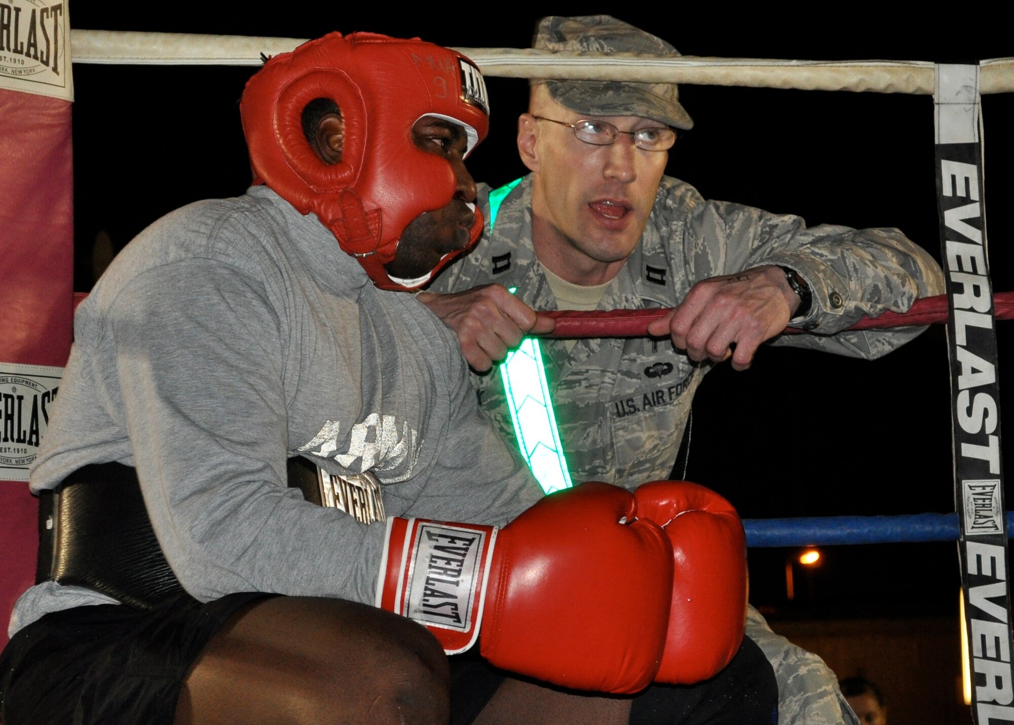 Chaplain (Capt.) Curt Cizek pumps up one of his "Bucca Boxing" trainees at Camp Bucca, Iraq.  Chaplain Cizek was involved in coaching, refereeing, and judging the boxing events.