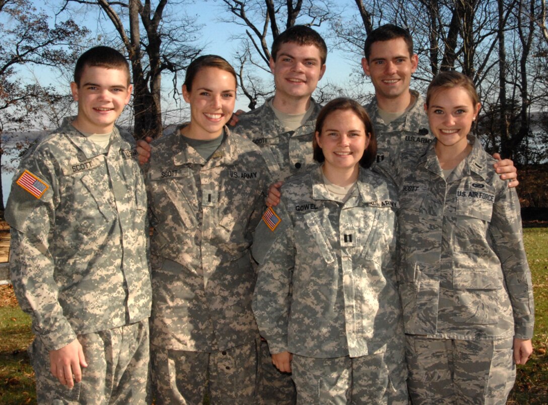Army Capt. Kate Gowel, bottom row, left, poses for a picture with her siblings at her parents’ home in Lorton, Va. Gowel, a military lawyer, was the first of six siblings to join the military. Courtesy photo