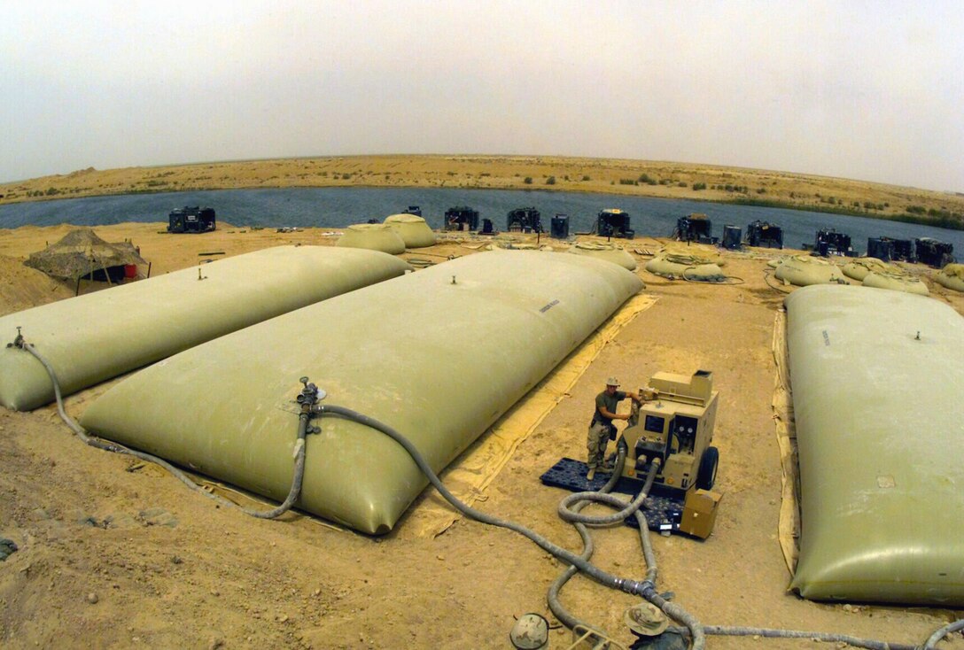 Defense Supply Center Richmond, Va., supplies the military with parts and supplies for reverse-osmosis water purification units like the one seen in use here by the Marine Corps during Operation Iraqi Freedom in 2003. U.S. Marine Corps photo by Master Sgt. Edward D. Kniery