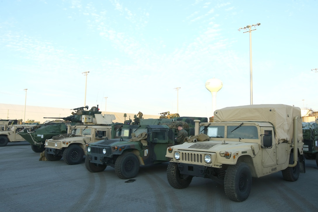 Vehicles from the 22nd Marine Expeditionary Unit sit on the pier at Morehead City, N.C. awaiting to be loaded onto the amphibioius assault ships USS Bataan, Carter Hall and Fort McHenry, Jan. 15, 2010.  The 22nd Marine Expeditionary Unit will deploy to the earthquake-ravaged Caribbean nation to conduct sea-based humanitarian assisstance and disaster relief.