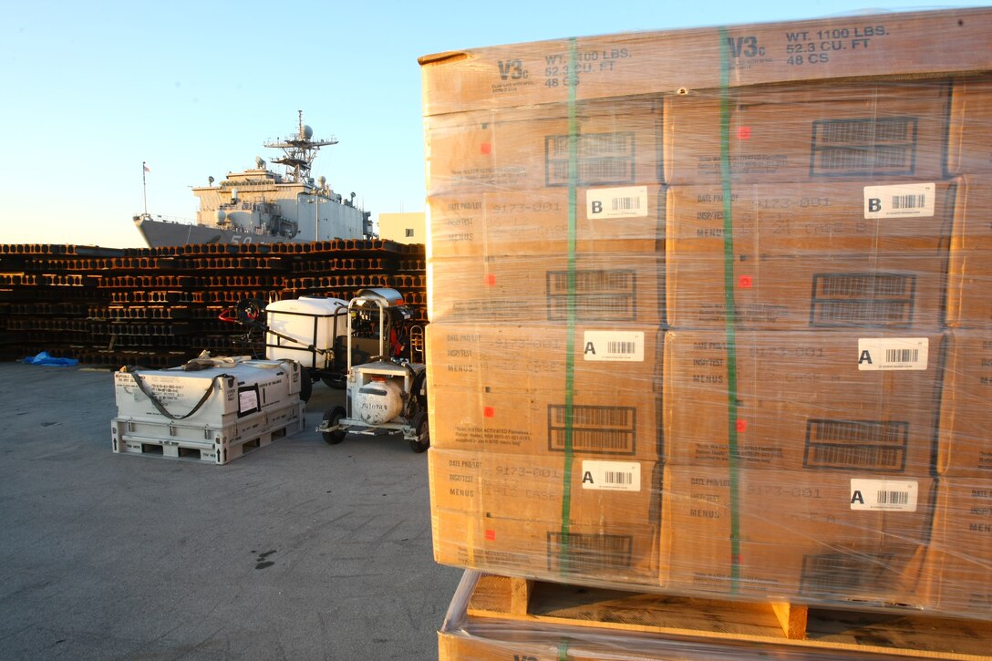 Pallets of food sit on the pier at Morehead City, N.C. awaiting to be loaded onto the amphibioius assault ships USS Bataan, Carter Hall and Fort McHenry, Jan. 15, 2010.  The 22nd Marine Expeditionary Unit will deploy to the earthquake-ravaged Caribbean nation of Haiti to conduct sea-based humanitarian assisstance and disaster relief.