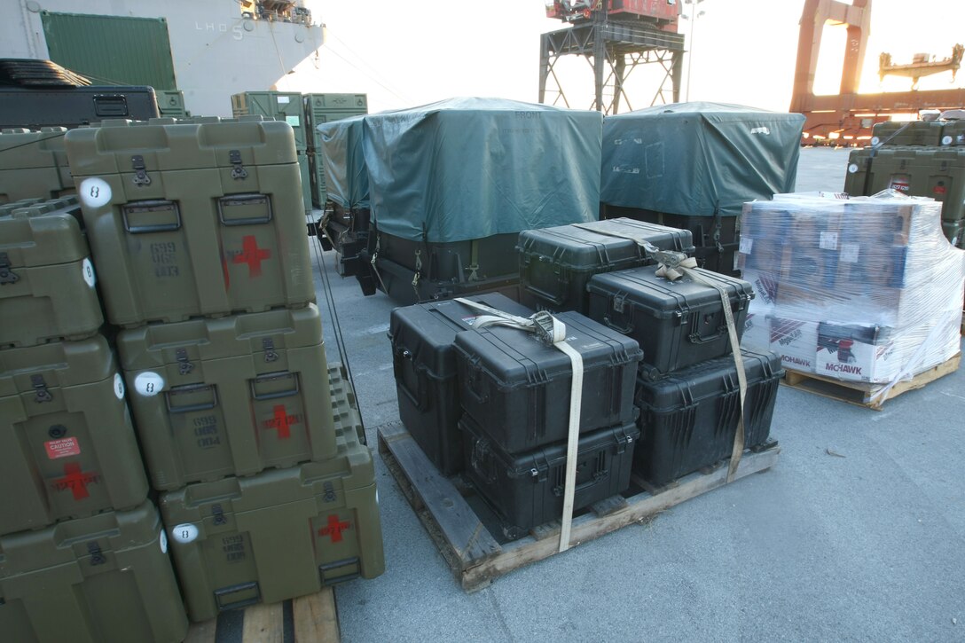 Supplies sit on the pier at Morehead City, N.C. awaiting to be loaded onto the amphibioius assault ships USS Bataan, Carter Hall and Fort McHenry, Jan. 15, 2010.  The 22nd Marine Expeditionary Unit will deploy to the earthquake-ravaged Caribbean nation of Haiti to conduct sea-based humanitarian assisstance and disaster relief.