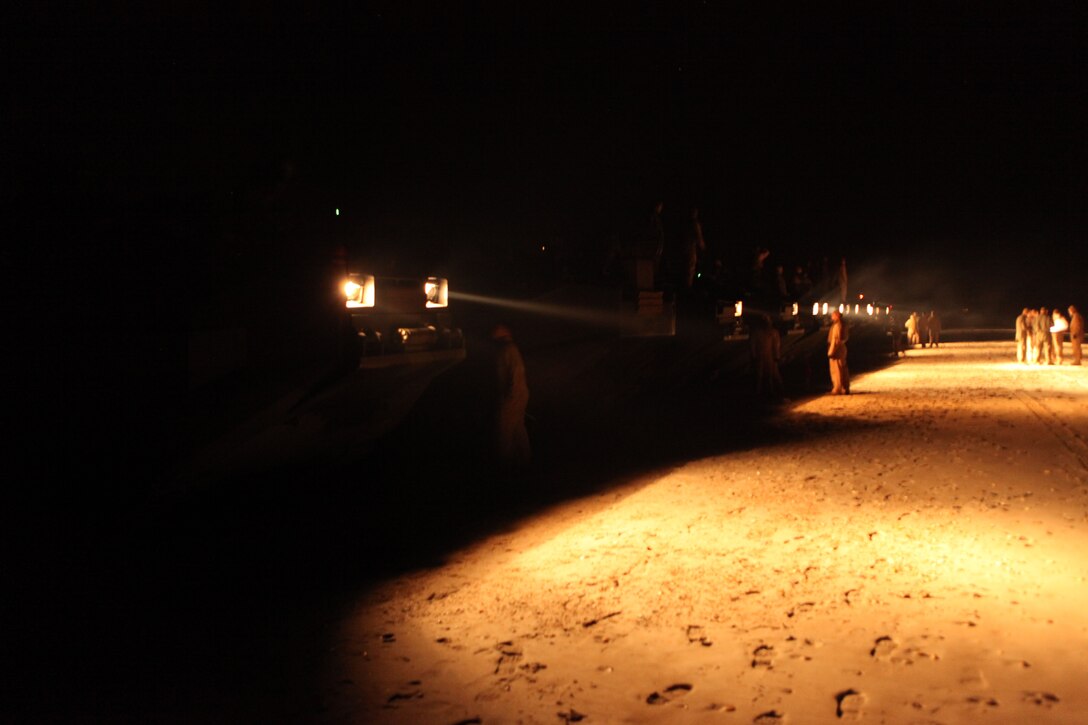 A platoon of assault amphibian vehicles wait for the order to enter the Atlantic Ocean off Onslow Beach aboard Camp Lejeune, N.C., Jan. 16, 2010.  A platoon of AAVs left Camp Lejeune in the pre-dawn hours to join the 22nd Marine Expeditionary embarked aboard the Bataan Amphibious Ready Group as it prepares to deploy to the Caribbean island nation of Haiti to provide sea-based disaster relief and humanitarian assistance in the wake of an earthquake that devastated the country on Jan. 12.