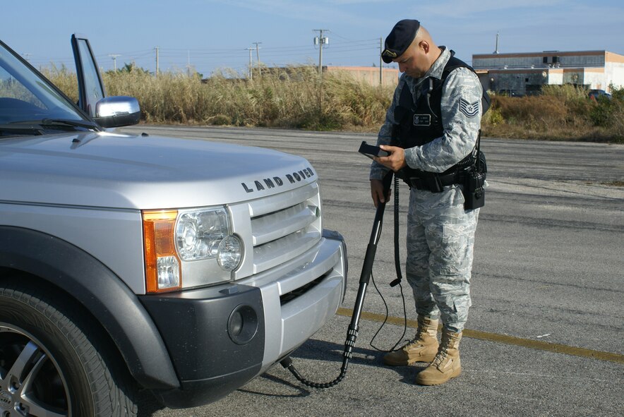 A member of the 482nd Security Forces Squadron, Homestead ARB, Fla., inspects a relief aid suppliers' vehicle prior to entering the base with much needed provisions for Haiti. (U.S. Air Force photo/Senior Airman Kaite Spencer)