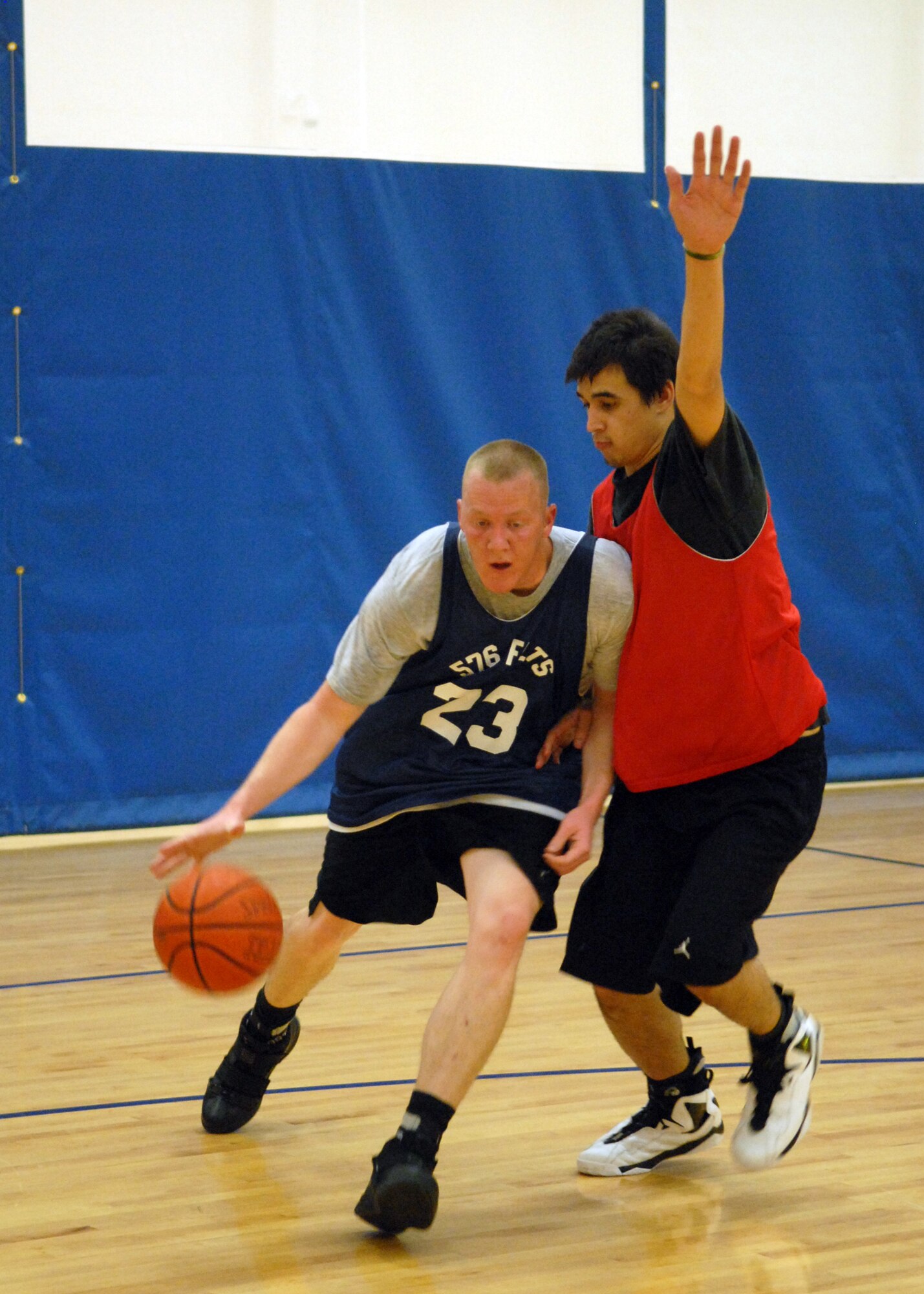 VANDENBERG AIR FORCE BASE, Calif. - Making his way around a defender, Jason Riggs of the 576th Flight Test Squadron pushes into the paint here Wednesday, Jan. 13, 2010. Kicking off the intramural basketball season the 30th Medical Group beat the 576th Flight Test Squadron 77-40. (U.S. Air Force photo/ Airman 1st Class Angelina Drake)
