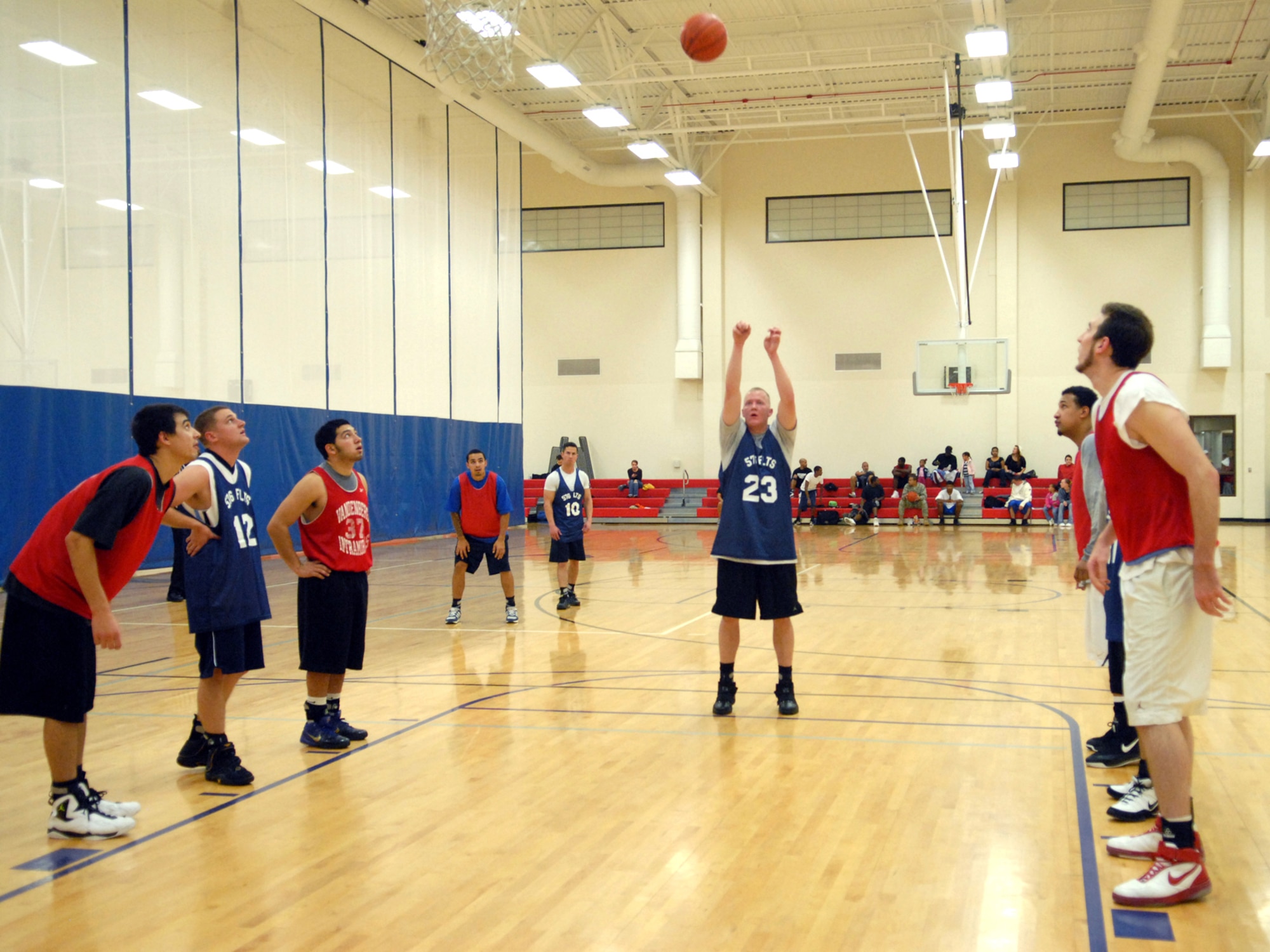 VANDENBERG AIR FORCE BASE, Calif. - Coming back from a foul, Jason Riggs, of the 576th Flight Test Squadron, launches the ball while both teams wait for their moment to rush for it here Wednesday, Jan. 13, 2010. Kicking off the intramural basketball season the 30th Medical Group beat the 576th Flight Test Squadron 77-40. (U.S. Air Force photo/ Airman 1st Class Angelina Drake)
