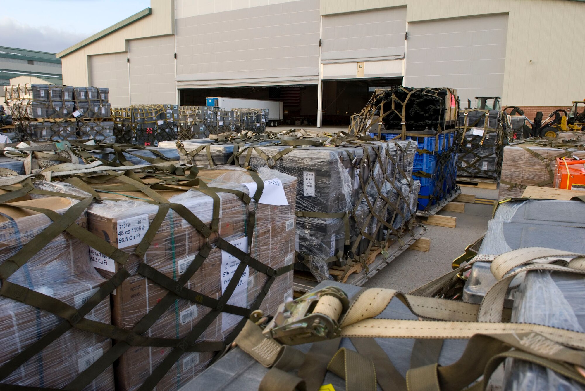 ows of pallets full of supplies bound for Haiti are staged outside an aircraft hangar on January 15, 2010 at the 167th Airlift Wing. The air base in Martinsburg, W.Va, was transformed Janunary 14 intoa staging area for more than 332,000 pounds of supplies bound for the airport at Port-au-Prince, Haiti. Hundreds of thousands of pounds more are expected to be palletized at the base for shipment to Haiti in the coming days. (U.S. Air Force photo by MSgt Emily Beightol-Deyerle)