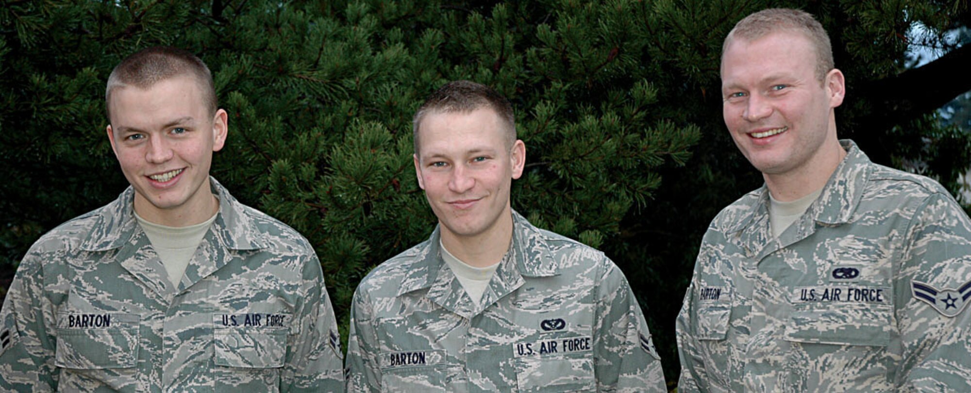 MCCHORD AIR FORCE BASE, Wash., -- Three of the 446th Airlift Wing's newest members bear a striking resemblance to each other... and for good reason.  They're not only part of the same wing family, they're part of the same family, period. From left are Airman 1st Class Jeremiah Barton, 21, 446th Maintenance Squadron; Airman 1st Class Josiah Barton, 23, 446th Civil Engineer Squadron; and Airman 1st Class Tristan Barton, 28, 446th Aircraft Maintenance Squadron. The brothers hail from Ridgefield, Wash., where they work in a family-owned home building company. They enlisted in the Air Force Reserve within two months of each other. The Bartons are adjusting nicely to McChord Air Force Base and their lives as Reservists.  "Everything about it's really cool," said Jeremiah. (U.S. Air Force photo/Staff Sgt. Grant Saylor)