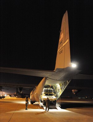 Staff Sgt. Lynzey Thorton, 41st Airlift Squadron Loadmaster, guides a Humvee into the back of a C-130J Jan. 14 at the Biloxi-Gulfport International Airport, Miss., as part of their mission to deliver equipment and personnel to support the Haitian relief effort. The aircraft launched from Little Rock Air Force Base, Ark., near midnight Jan. 13, loaded personnel and equipment before dawn Jan. 14 at Biloxi-Gulfport International Airport, Miss., and delivered them the morning of Jan. 14 as part of on-going Haitian relief efforts.  (USAF Photo by Staff Sgt. Chad Chisholm) (Cleared by Mr. Arlo Taylor, 19th Airlift Wing Public Affairs)