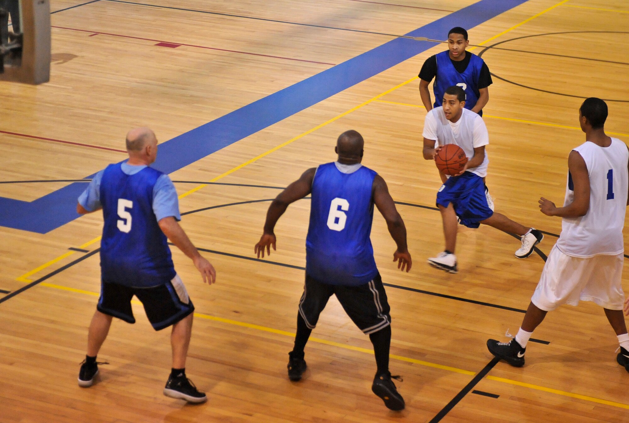 ELMENDORF AIR FORCE BASE, Alaska – The Coast Guard’s Ryan Dexter Registe drives to the hoop during a playoff game against the 525th Fighter Squadron Jan. 14. The CG won with the score of 66-64. (Air Force photo by Airman 1st Class Christopher Gross)