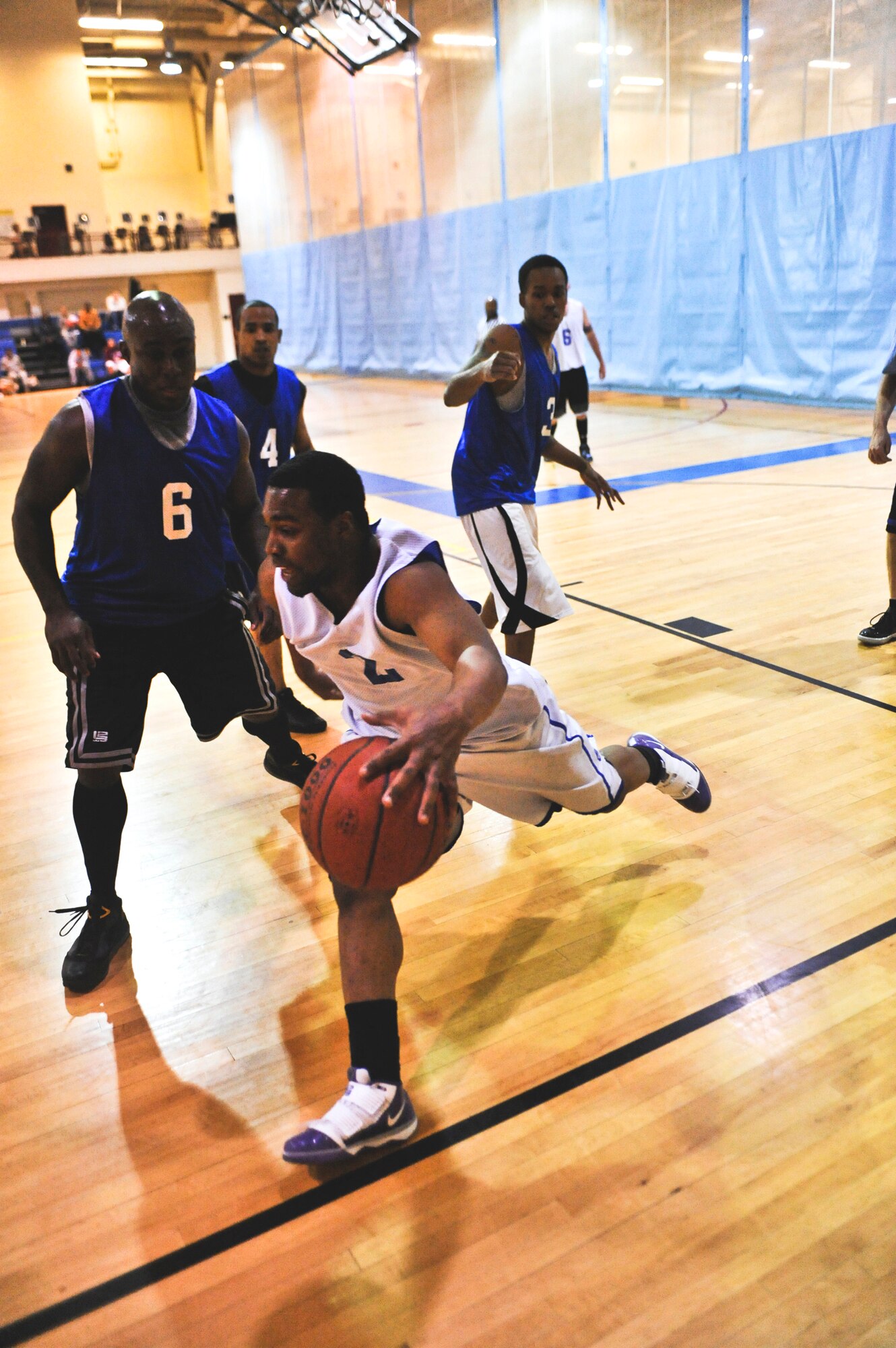 ELMENDORF AIR FORCE BASE, Alaska – The Coast Guard’s Ryan May tries to keep the ball inbounds during a playoff game against the 525th Fighter Squadron Jan. 14. The CG won with the score of 66-64. (Air Force photo by Airman 1st Class Christopher Gross)