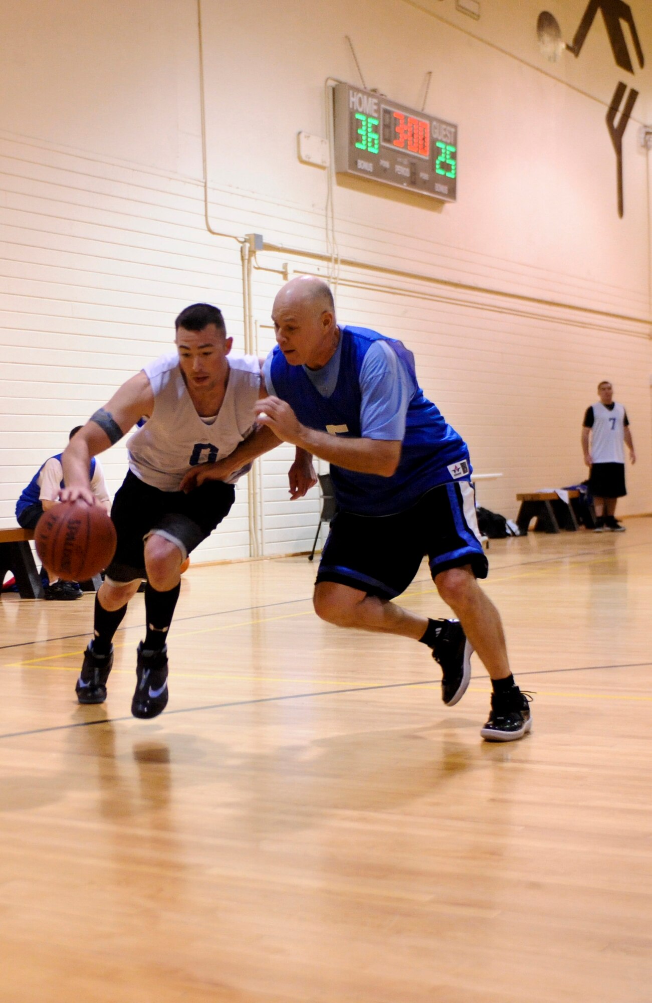 ELMENDORF AIR FORCE BASE, Alaska – The 525th Fighter Squadron’s Martin Page tries to take the ball away from The Coast Guard’s Stevo Kelly during a playoff game Jan. 14. The CG won with the score of 66-64. (Air Force photo by Airman 1st Class Christopher Gross)