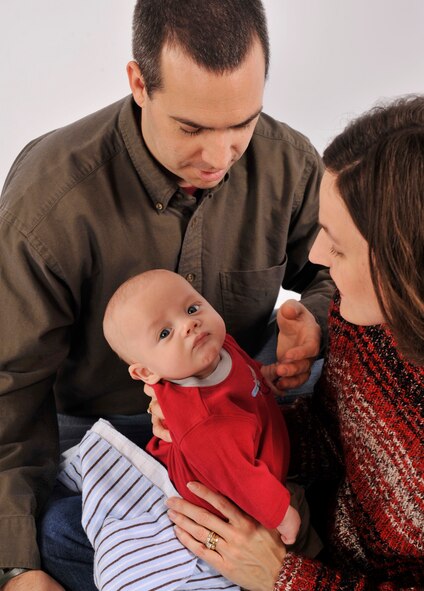 MOODY AIR FORCE BASE, Ga. -- Maj. Richard Waldrop and his wife, Kristen, gaze at their son Andrew. Andrew, who was born Sept. 29, 2009, is the adopted son of the Waldrops. (U.S. Air Force photo by Staff Sgt. Schelli Jones)