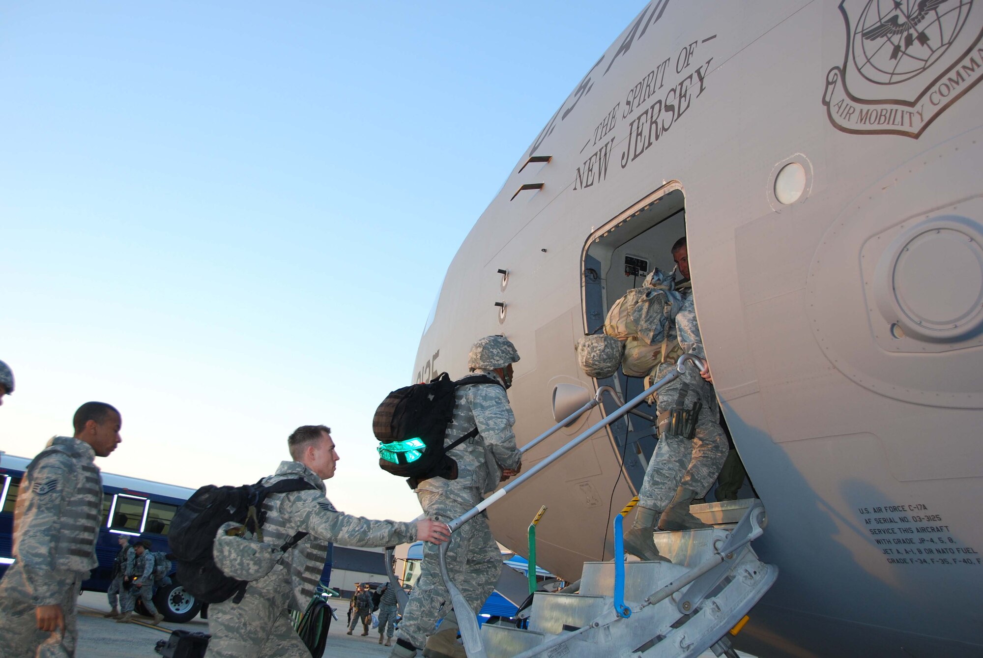 JOINT BASE MCGUIRE-DIX- LAKEHURST, N.J. - Air Force members from the 621st Contingency Response Wing stationed here board a C-17 Globemaster III for departure to Toussaint Louverture International Airport, Haiti, Jan. 14. Reserve crews from the 732nd Airlift Squadron, here, flew several humanitarion missions to the earthquake stricken country bringing equipment, supplies and more than 70 support personel to aid in relief efforts. (U.S. Air Force photo/Master Sgt. Donna T. Jeffries)