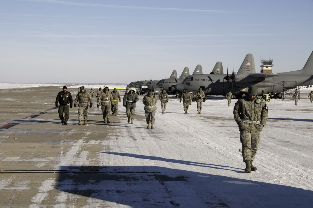 139th Airlift Wing maintenance members perform a foreign object debri (FOD) check during a unit compliance inspection, in sub-zero temperatures on January 10, 2010. (U.S. Air Force photo by Master Sgt. Shannon Bond) (RELEASED)
