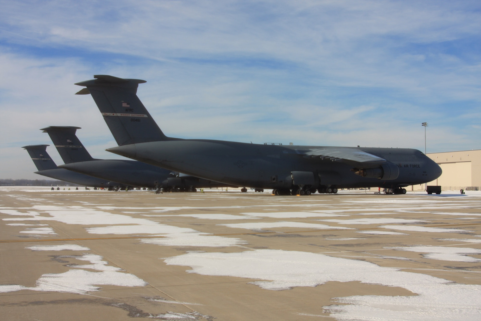 WRIGHT-PATTERSON AIR FORCE BASE, Ohio – Snow patches surround the C-5 Galaxy aircraft sitting on the flightline at the 445th Airlift Wing on a cold wintery day in December. (U.S. Air Force photo/Senior Airman Mikhail Berlin) 
