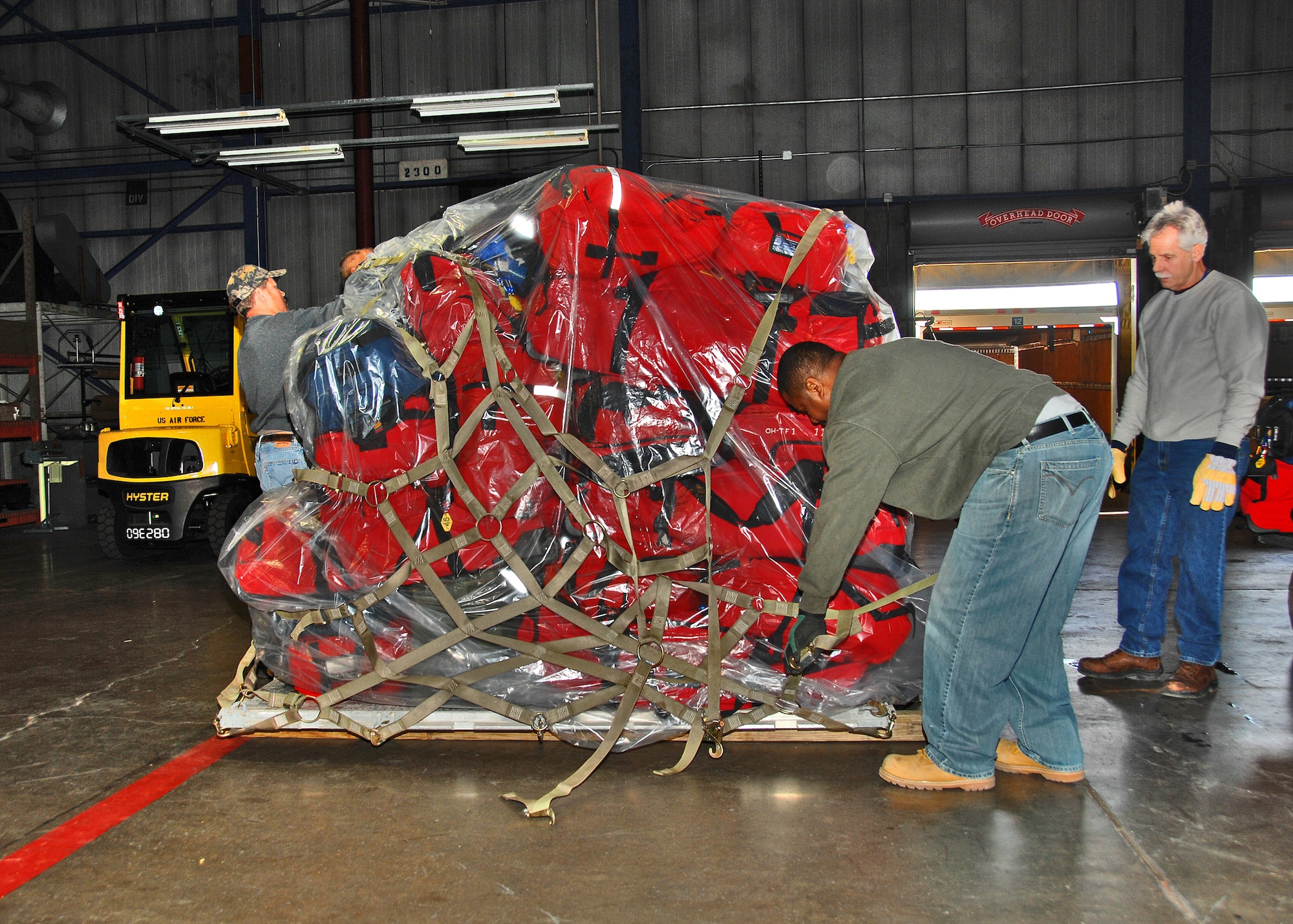 Workers at Wright-Patterson AFB, Ohio palletize Federal Emergency Management Agency equipment on 14 January, 2010, in preparation for deployment to Haiti.  Ohio Task Force One, made up of approximately  80 first-responders  from across the Miami Valley and their equipment, is staging at the base while awaiting airlift into Haiti.  The team will provide humanitarian and disaster relief in response to the recent earthquake. (AF Photo by Mr. Ben Strasser)