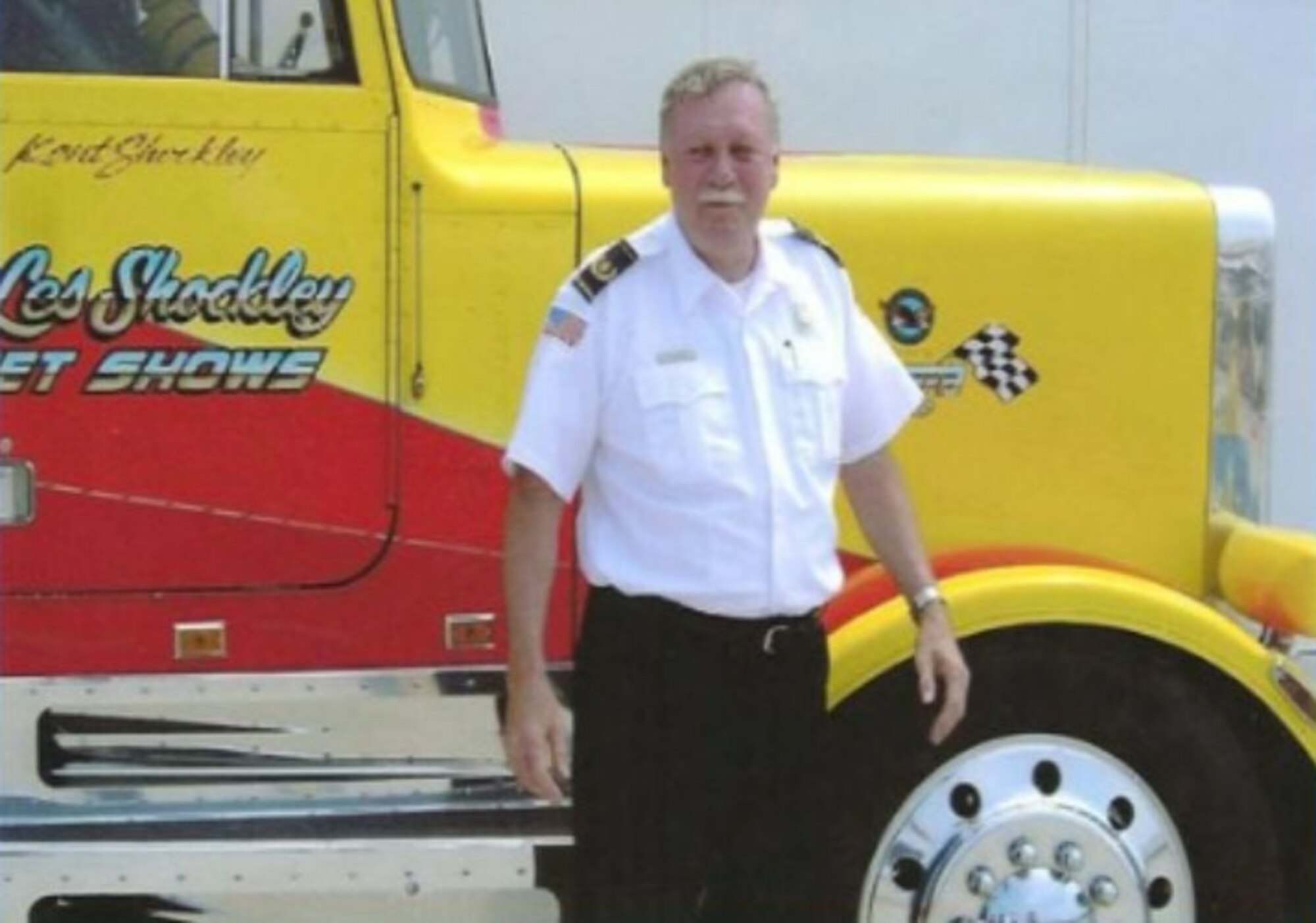 Fire Chief Robert Vires stands near the Shockwave Jet Truck during Barksdale's Air Show.  Chief Vires was the passenger in the truck known for racing aircraft at speeds topping 300mph.  (Courtesy of the Vires Family)