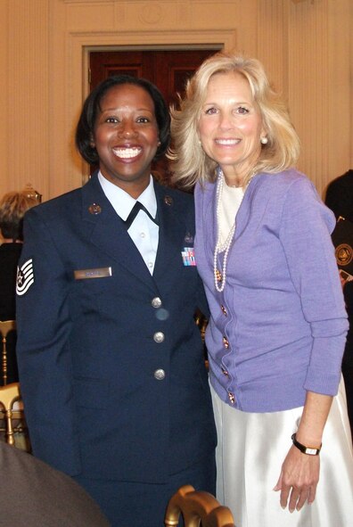 WASHINGTON -- Tech. Sgt. April M. Sharpe, the NCOIC of the client service center, poses with Dr. Jill Biden, wife of Vice President Joe Biden, at the White House during an event to honor women in the military, Nov. 18, 2009.