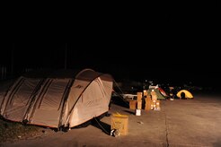 Tents on the edge of the runway at the Port-au-Prince airport, Haiti, provide shelter to U.S. military personnel participating in the relief effort in Haiti after a devastating earthquake, Jan. 15, 2010.  (U.S. Air Force photo by Staff Sgt. Joshua L. DeMotts) (Released)