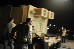 U.S.Air Force personnel from the 621st Contingency Response Wing, Joint Base McGuire-Dix-Lakehurst, N.J., off load cargo from a Charleston Air Force Base, S.C., C-17 Globemaster III, Jan. 15, 2010, at the Port-au-Princce airport in support relief efforts to Haiti  in the aftermath of a devastating earthquake.  (U.S. Air Force photo by Staff Sgt. Joshua L. DeMotts) (Released)