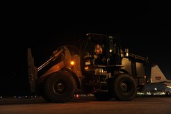 U.S.Air Force personnel from the 621st Contingency Response Wing, Joint Base McGuire-Dix-Lakehurst, N.J., off load cargo from a Charleston Air Force Base, S.C., C-17 Globemaster III, Jan. 15, 2010, at the Port-au-Princce airport in support relief efforts to Haiti  in the aftermath of a devastating earthquake.  (U.S. Air Force photo by Staff Sgt. Joshua L. DeMotts) (Released)