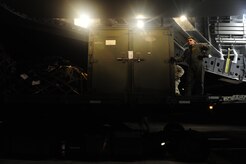 U.S.Air Force Master Sgt. Michael Lang, a reservists from the 317th Airlift Squadron, 437th Air Mobility Wing, Charleston Air Force Base, S.C., takes a quick break to look out at the Port-au-Prince airport runway during relief efforts to Haiti, Jan. 15, 2010, in the aftermath of a devastating earthquake.  (U.S. Air Force photo by Staff Sgt. Joshua L. DeMotts) (Released)