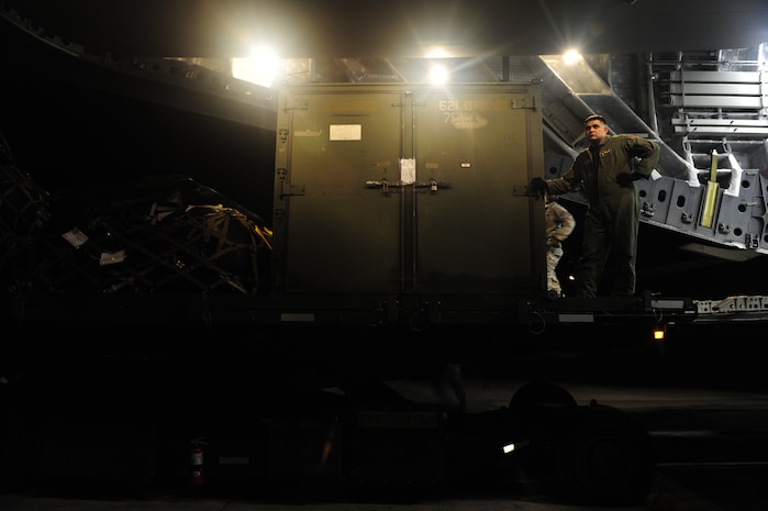 U.S.Air Force Master Sgt. Michael Lang, a reservists from the 317th Airlift Squadron, 437th Air Mobility Wing, Charleston Air Force Base, S.C., takes a quick break to look out at the Port-au-Prince airport runway during relief efforts to Haiti, Jan. 15, 2010, in the aftermath of a devastating earthquake.  (U.S. Air Force photo by Staff Sgt. Joshua L. DeMotts) (Released)