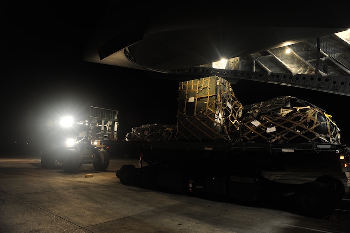 U.S.Air Force personnel from the 621st Contingency Response Wing, Joint Base McGuire-Dix-Lakehurst, N.J., off load cargo from a Charleston Air Force Base, S.C., C-17 Globemaster III, Jan. 15, 2010, at the Port-au-Princce airport in support relief efforts to Haiti  in the aftermath of a devastating earthquake.  (U.S. Air Force photo by Staff Sgt. Joshua L. DeMotts) (Released)