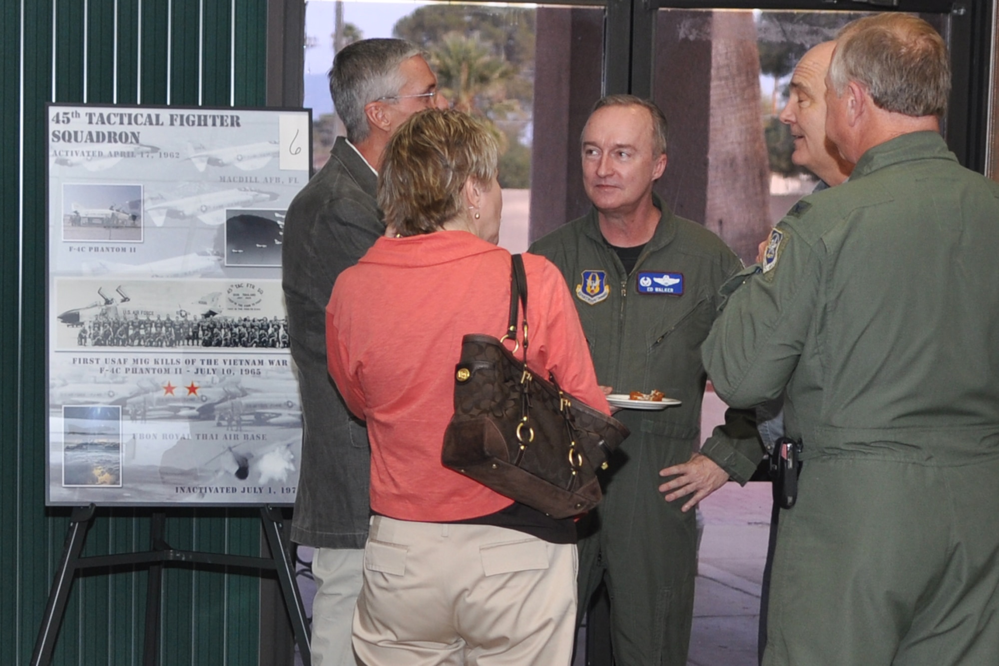 Col. Edmund Walker, commander of the 917th Wing on Barksdale Air Force Base, La., speaks with some of the guests in attendance at the 45th Fighter Squadron reactivation ceremony on Davis-Monthan Air Force Base, Ariz., January 7, 2010. The reactivation of this unit will allow the squadron to rejoin the A-10 Thunderbolt II community under the command of the 917th Operations Group on Barksdale. (U.S. Air Force photo/Tech. Sgt. Jeffery Walston)
