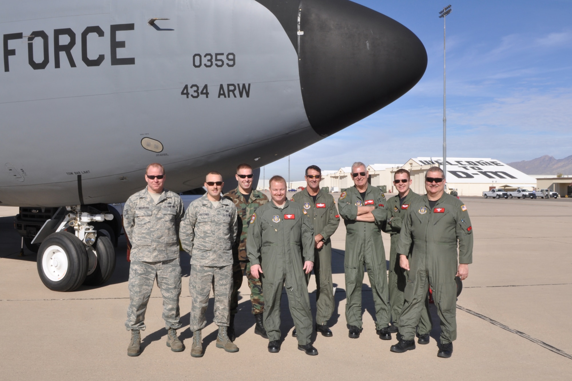 Members of an aircrew out of Grissom Air Reserve Base, Ind., come together for a group photo during the reactivation ceremony of the 45th Fighter Squadron on Daivs-Monthan Air Force Base, Ariz., January 7, 2010. The crew transported a group of 45th FS retirees to the ceremony using a KC-135 Stratotanker. (U.S. Air Force photo/Tech. Sgt. Jeffery Walston)