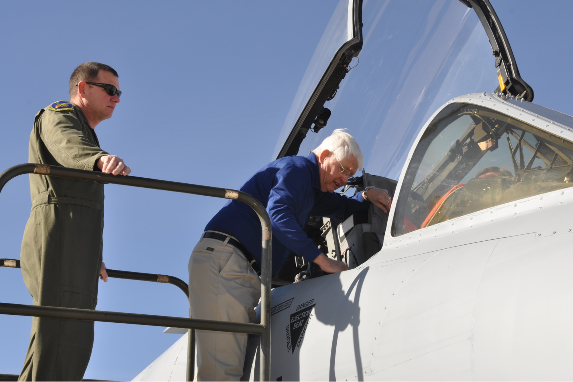 Lt. Col. James Macaulay, the 917th Wing Operations Group deputy commander for A-10 Thunderbolt IIs, looks on as retired Maj. Gen. Robert Nester tours an A-10 Thunderbolt during a static display for a reactivation ceremony on Davis-Monthan Air Force Base, Ariz., January 7, 2010. General Nester attended the 45th Fighter Squadron reactivation as the guest speaker for the event. He shared stories and memories with all in attendance as he attested to the rich history of the unit.  (U.S. Air Force photo/Tech. Sgt. Jeffery Walston)