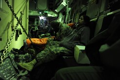 U.S. Air Force personnel with the 621st Contingency Response Wing, Joint Base McGuire-Dix-Lakehurst, N.J., catch a ride on a Charleston Air Force Base C-17 Globemaster III, Jan. 15, 2010, en route to Port-au-Prince, Haiti, in support of the relief efforts going on there after a devastating earthquake.  (U.S. Air Force photo by Staff Sgt. Joshua L. DeMotts) (Released)
