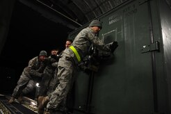 U.S. Air Force personnel from the 621st   Contingency Response Wing, Joint Base McGuire-Dix-Lakehurst, N.J., load cargo onto a Charleston Air Force Base, S.C., C-17 Globemaster III, supporting a swift and coordinated relief effort to Haiti, Jan. 14, 2010, in the aftermath of a devastating earthquake.  (U.S. Air Force photo by Staff Sgt. Joshua L. DeMotts) (Released)