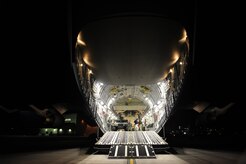 U.S. Air Force personnel from the 621st   Contingency Response Wing, Joint Base McGuire-Dix-Lakehurst, N.J., load cargo onto a Charleston Air Force Base, S.C., C-17 Globemaster III, supporting a swift and coordinated relief effort to Haiti, Jan. 14, 2010, in the aftermath of a devastating earthquake.  (U.S. Air Force photo by Staff Sgt. Joshua L. DeMotts) (Released)