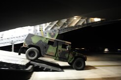 A U.S. Air Force Humvee is loaded onto a Charleston AFB C-17 Globemaster III, on Joint Base McGuire-Dix-Lakehurst, N.J., in support of relief efforts to Haiti, Jan. 14, 2010 in the aftermath of a devastating earthquake.  (U.S. Air Force photo by Staff Sgt. Joshua L. DeMotts) (Released)