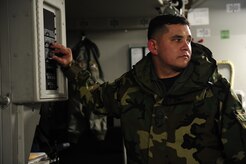 U.S. Air Force Master Sgt. Michael Lang, a reservist Loadmaster with the 317th Airlift Squadron, 437th Air Mobility Wing, Charleston Air Force Base, S.C., operates a hoist while loading cargo on a Charleston AFB, C-17 Globemaster III, on Joint Base McGuire-Dix-Lakehurst, N.J., in support of relief efforts to Haiti, Jan. 14, 2010 in the aftermath of a devastating earthquake.  (U.S. Air Force photo by Staff Sgt. Joshua L. DeMotts) (Released)