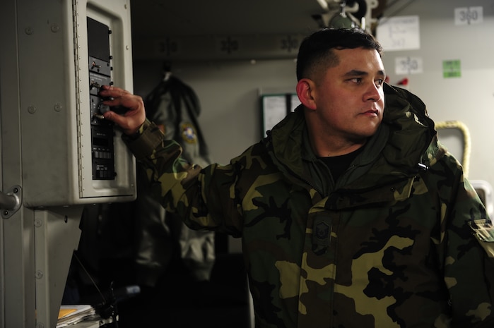 U.S. Air Force Master Sgt. Michael Lang, a reservist Loadmaster with the 317th Airlift Squadron, 437th Air Mobility Wing, Charleston Air Force Base, S.C., operates a hoist while loading cargo on a Charleston AFB, C-17 Globemaster III, on Joint Base McGuire-Dix-Lakehurst, N.J., in support of relief efforts to Haiti, Jan. 14, 2010 in the aftermath of a devastating earthquake.  (U.S. Air Force photo by Staff Sgt. Joshua L. DeMotts) (Released)