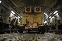 U.S. Air Force personnel from the 621st   Contingency Response Wing, Joint Base McGuire-Dix-Lakehurst, N.J., load cargo onto a Charleston Air Force Base, S.C., C-17 Globemaster III, supporting a swift and coordinated relief effort to Haiti, Jan. 14, 2010, in the aftermath of a devastating earthquake.  (U.S. Air Force photo by Staff Sgt. Joshua L. DeMotts) (Released)