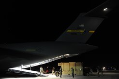 U.S. Air Force personnel from the 621st   Contingency Response Wing, Joint Base McGuire-Dix-Lakehurst, N.J., load cargo onto a Charleston Air Force Base, S.C., C-17 Globemaster III, supporting a swift and coordinated relief effort to Haiti, Jan. 14, 2010, in the aftermath of a devastating earthquake.  (U.S. Air Force photo by Staff Sgt. Joshua L. DeMotts) (Released)