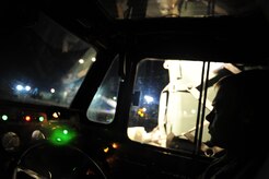 U.S.Air Force Senior Airman Blair Sawyer with the 305th Aerial Port Service, Joint Base McGuire-Dix-Lakehurst, delivers pallets of cargo to a Charleston Air Force Base, S.C., C-7 Globemaster III, in support of relief efforts to Haiti, Jan. 14, 2010, in the aftermath of a devastating earthquake.  (U.S. Air Force photo by Staff Sgt. Joshua L. DeMotts) (Released)