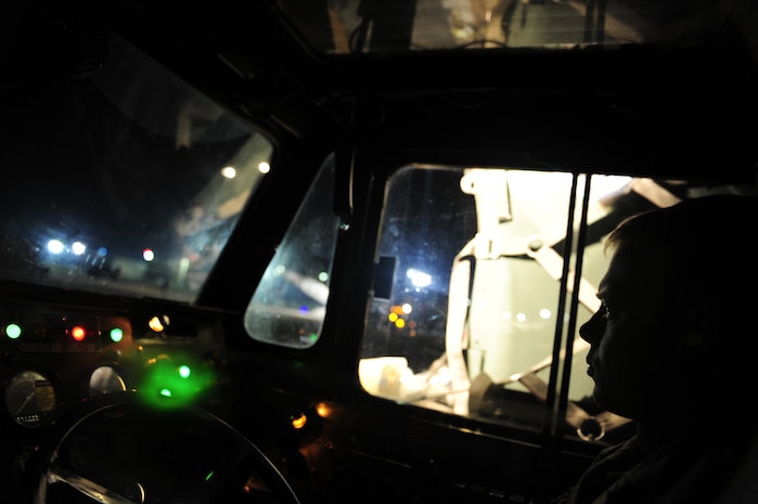 U.S.Air Force Senior Airman Blair Sawyer with the 305th Aerial Port Service, Joint Base McGuire-Dix-Lakehurst, delivers pallets of cargo to a Charleston Air Force Base, S.C., C-7 Globemaster III, in support of relief efforts to Haiti, Jan. 14, 2010, in the aftermath of a devastating earthquake.  (U.S. Air Force photo by Staff Sgt. Joshua L. DeMotts) (Released)