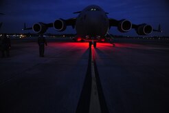 U.S.Air Force Technical Sgt. Robert Mabry a reservist Loadmaster with the 317th Airlift Squadron, 437th Air Mobility Wing, Charleston Air Force Base (AFB), S.C., conducts pre-flight duties on the Charleston AFB flight line, en route to support relief efforts to Haiti, Jan. 14, 2010 in the aftermath of a devastating earthquake.  (U.S. Air Force photo by Staff Sgt. Joshua L. DeMotts) (Released)