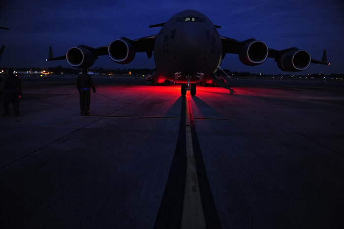 U.S.Air Force Technical Sgt. Robert Mabry a reservist Loadmaster with the 317th Airlift Squadron, 437th Air Mobility Wing, Charleston Air Force Base (AFB), S.C., conducts pre-flight duties on the Charleston AFB flight line, en route to support relief efforts to Haiti, Jan. 14, 2010 in the aftermath of a devastating earthquake.  (U.S. Air Force photo by Staff Sgt. Joshua L. DeMotts) (Released)
