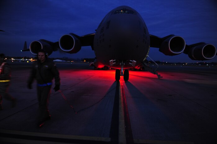 U.S.Air Force Technical Sgt. Robert Mabry a reservist Loadmaster with the 317th Airlift Squadron, 437th Air Mobility Wing, Charleston Air Force Base (AFB), S.C., conducts pre-flight duties on the Charleston AFB flight line, en route to support relief efforts to Haiti, Jan. 14, 2010 in the aftermath of a devastating earthquake.  (U.S. Air Force photo by Staff Sgt. Joshua L. DeMotts) (Released)