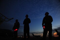 Airmen from the 437th Air Mobility Wing, Charleston Air Force Base, S.C., prepare to taxi a C-17 Globemaster III, in support of coordinated relief efforts to Haiti, Jan. 14, 2010, in the aftermath of a devastating earthquake.  (U.S. Air Force photo by Staff Sgt. Joshua L. DeMotts) (Released)