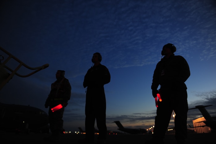 Airmen from the 437th Air Mobility Wing, Charleston Air Force Base, S.C., prepare to taxi a C-17 Globemaster III, in support of coordinated relief efforts to Haiti, Jan. 14, 2010, in the aftermath of a devastating earthquake.  (U.S. Air Force photo by Staff Sgt. Joshua L. DeMotts) (Released)