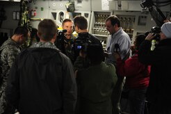 U.S. Air Force Technical Sgt. Robert Mabry, a reservist Loadmaster with the 317th Airlift Squadron, 437th Air Mobility Wing, Charleston Air Force Base (AFB), S.C., is interviewed by local media on board a Charleston AFB, C-17 Globemaster III, prior to participation in a swift and coordinated relief effort to Haiti, Jan. 14, 2010, in the aftermath of a devastating earthquake.  (U.S. Air Force photo by Staff Sgt. Joshua L. DeMotts) (Released)
