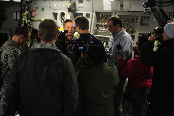 U.S. Air Force Technical Sgt. Robert Mabry, a reservist Loadmaster with the 317th Airlift Squadron, 437th Air Mobility Wing, Charleston Air Force Base (AFB), S.C., is interviewed by local media on board a Charleston AFB, C-17 Globemaster III, prior to participation in a swift and coordinated relief effort to Haiti, Jan. 14, 2010, in the aftermath of a devastating earthquake.  (U.S. Air Force photo by Staff Sgt. Joshua L. DeMotts) (Released)
